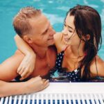 elegant-couple-swim-in-the-pool-XNWHKDR-ongb8zhzye1wl99xj2aktd17i7d26952qlja22btsw